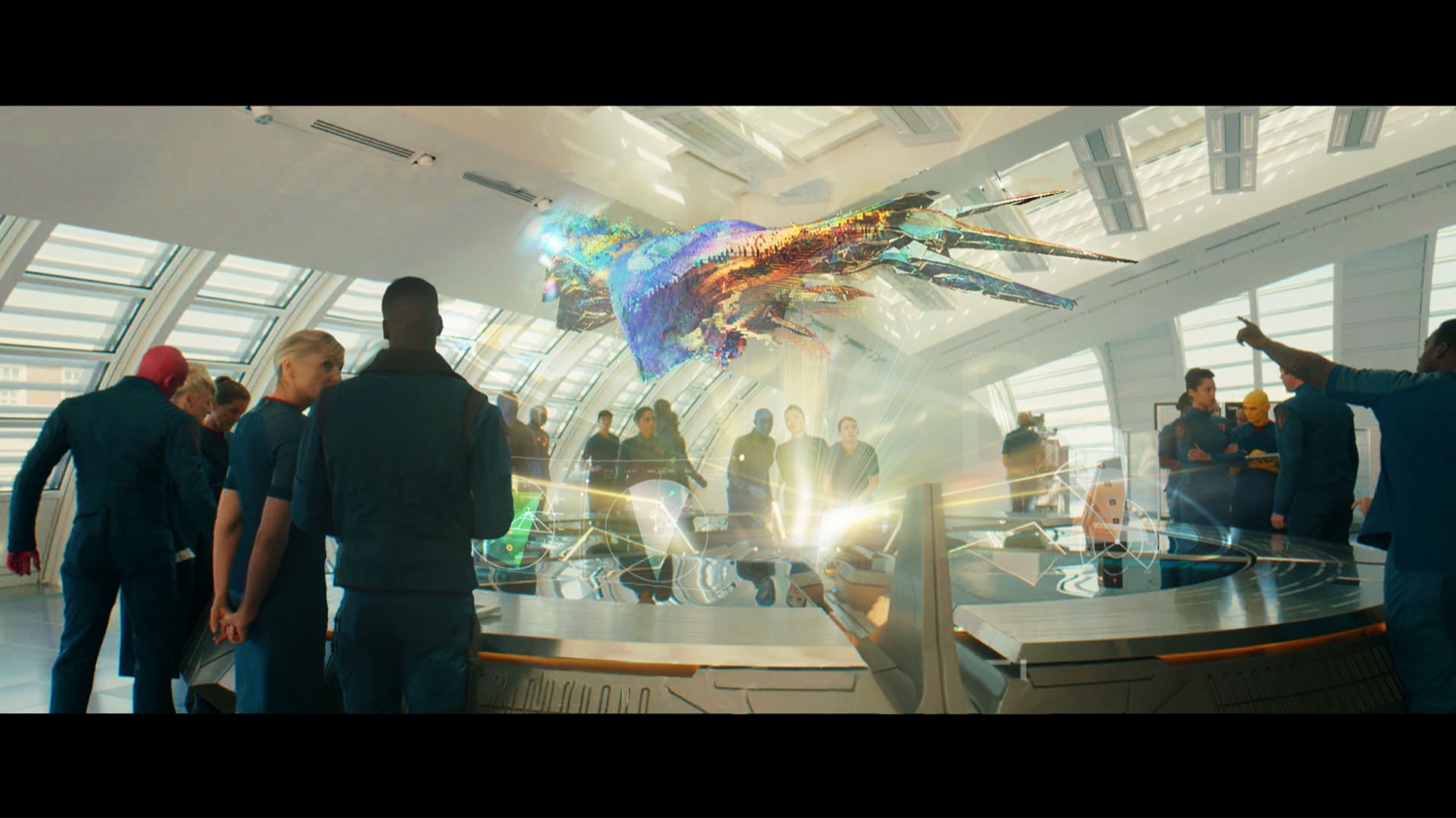 Film VFX shot — the same hologram resolving into a shape the crowd points at